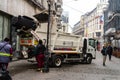 Garbage truck in the morning collecting garbage from the streets of the Old Town of Bucharest, Romania, 2020 Royalty Free Stock Photo