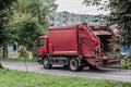 Garbage truck moving on a city street Royalty Free Stock Photo