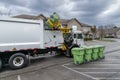 Garbage Truck Picking Up And Dumping Residential Trash Containers