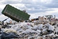 Garbage truck unloading garbage at dumping ground Royalty Free Stock Photo