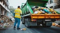 Garbage truck unloading trash at landfill site under cloudy sky Royalty Free Stock Photo