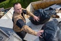 Garbage truck worker man collecting plastic industrial vehicle Royalty Free Stock Photo