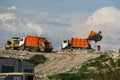 A garbage trucks unloads garbage at a large landfill near Kyiv, Ukraine. May 2016