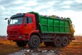 Garbage trucks at work, emptying waste containers for proper disposal