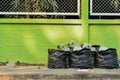 Garbage and waiste in black bags Royalty Free Stock Photo