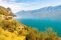 Scenic view from the edge of western coast of Garda lake on beautiful northern Italian nature surrounding this amazing lake. Rocky