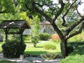 Garden with an antique wood well on Lake Garda in Italy. Royalty Free Stock Photo