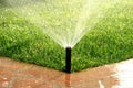 Garden automatic irrigation system watering lawn Royalty Free Stock Photo