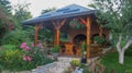 Garden Or Backyard Outdoor Pavilion With Wood Pergola, Bar Counter, Brick Oven, Fireplace And Barbecue For Cookout Food. Summer