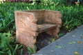 A garden bench with mythological creature sculpture