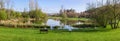 Garden bench overlooking the lake or pond of Parque da Devesa Urban Park in Vila Nova de Famalicao Royalty Free Stock Photo