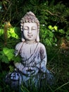 Garden Buddha statue in summer