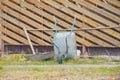 Garden cart stands by the barn on a spring day Royalty Free Stock Photo