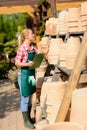 Garden center woman check clay pots