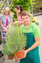 Garden centre worker hold potted plant Royalty Free Stock Photo