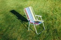 Garden chair on green lawn background Royalty Free Stock Photo