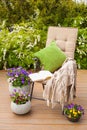 Garden chair on terrace, relax, flowers, bush