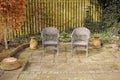 Garden chairs, furniture and seating in a secluded and peaceful courtyard or home backyard. Handmade, craft and rustic