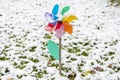 The garden children`s windmill is covered with the first snow, close-up. Snowfall and high precipitation in winter, the beginning
