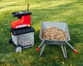 Garden chipper, electric shredder mulcher with wheelbarrow full of wooden mulch