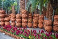 A garden of clay pots with human faces. Nong Nooch Tropical Park Royalty Free Stock Photo