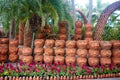 A garden of clay pots with human faces in the Nong Nooch Tropical Park. Royalty Free Stock Photo