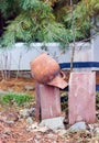 Garden composition decoration broken jug on the fence Royalty Free Stock Photo