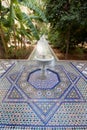 Garden courtyard with fountain and mosaic tiles in Moroccan palace