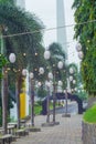 the garden is decorated with hanging lights and lanterns Royalty Free Stock Photo