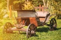 Garden Decoration Concept. Decorative Yard Wagon On Summer Lawn. Bright Sunny Day. Gardening And Housekeeping. Vintage Royalty Free Stock Photo