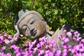 Garden decoration with a lying buddha.