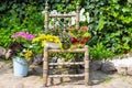 Garden decoration with a old chair. Royalty Free Stock Photo