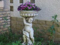 Garden statue with flowers