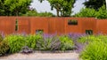 Garden design with a rusted garden screen