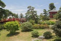 21 May, 2018 - Nha Trang city, Viet Nam. Beautiful landscape with trees, red bridge, house in Japanese garden