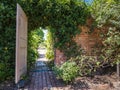 Garden doorway with brick path Royalty Free Stock Photo