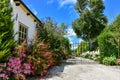 Garden Entrance with colorful flowers and iron gate Royalty Free Stock Photo