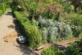 One of the gardens with garden equipment at Sissinghurst Castle in Kent in England in the summer. Royalty Free Stock Photo