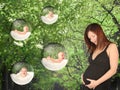 In garden an expectant mother dreams about babies Royalty Free Stock Photo