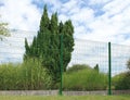 Garden fence and gate in rigid wire mesh panels