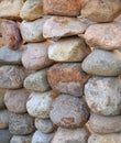 Garden fence of large natural round stones. Royalty Free Stock Photo