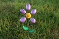 Garden flower made of painted rocks and metal