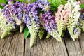 Garden flowers over blue wooden table background. Backdrop with copy space Royalty Free Stock Photo