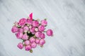 Garden flowers over grey wooden table background. Backdrop with copy space Royalty Free Stock Photo