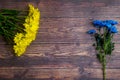 Garden flowers over wooden table background