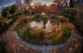 Garden fountain at sunset Royalty Free Stock Photo