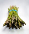 Garden fresh organic asparagus on soft grey table cloth