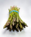 Garden fresh organic asparagus on soft grey table cloth Royalty Free Stock Photo