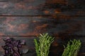 Garden fresh herbs rosemary, thyme, basil, on old dark  wooden table background, top view flat lay, with copy space for text Royalty Free Stock Photo