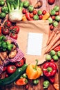 Garden fresh vegetables and blank brown paper